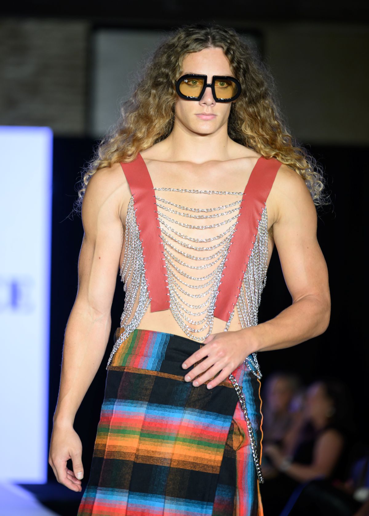 Model Treven on the New York Fashion Week runway wearing designs by Unique Custom Threads and HEED NYC